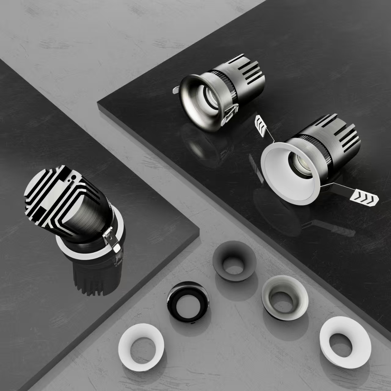 Recessed spotlight housing components laid out: body, reflector, trim ring and mounting springs